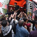 Volunteers distribute food among the mourners during the main procession of 9th Muharram-ul-Haram, commonly known as Youm-e-Ashura in G-6 sector. Muharram-ul-Haram, the first month of the Islamic calendar, is a period of mourning in remembrance of the martyrdom of Hazrat Imam Hussain (AS), the grandson of the Holy Prophet Muhammad (SAWW), along with his family and companions at Karbala