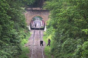 Railway workers carry out repair work on the track near Korang Tunnel — a historic 50-meter-long structure built in 1914 by British engineers. Located adjacent to the Korang Bridge, which spans the Korang River originating from the Murree Hills, the tunnel is part of the active Karachi–Peshawar Railway Line (ML-1)