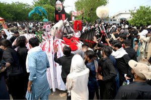 Volunteers distribute food among the mourners during the main procession of 9th Muharram-ul-Haram, commonly known as Youm-e-Ashura in G-6 sector. Muharram-ul-Haram, the first month of the Islamic calendar, is a period of mourning in remembrance of the martyrdom of Hazrat Imam Hussain (AS), the grandson of the Holy Prophet Muhammad (SAWW), along with his family and companions at Karbala
