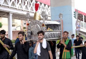 Shia Muslims attend the mourning procession of 10th Muharram ul Harram, to commemorate the death anniversary of Hazrat Imam Hussein, the grandson of prophet Muhammad (PBUH) and his companion, who were martyred in the battle of Karbala, Iraq