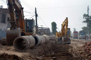 Heavy machinery being used for the installation of a sewerage line as part of ongoing development work on Vehari Road