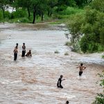 Youngsters enjoying swim in the Rawal Dam spillway stream opened due to high level of water after the 2nd spell of Monsoon rain in the federal capital.