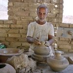 A craftsman preparing clay-made stuff at his work place Kumharpara near Jamshoro road