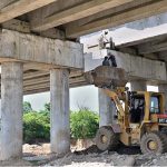 Labourers busy in construction work of flyover at under construction 10th Avenue during development work in Federal Capital