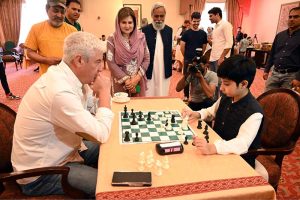 H.E. Frederico Silva, Ambassador of Portugal to Pakistan, takes part in the Portugal-Pakistan Chess Tournament, while Farah Naz Akbar, Parliamentary Secretary for the Ministry of Federal Education & Professional Training, observes the game. The tournament was held at a local hotel to mark 75 years of diplomatic relations between the two countries