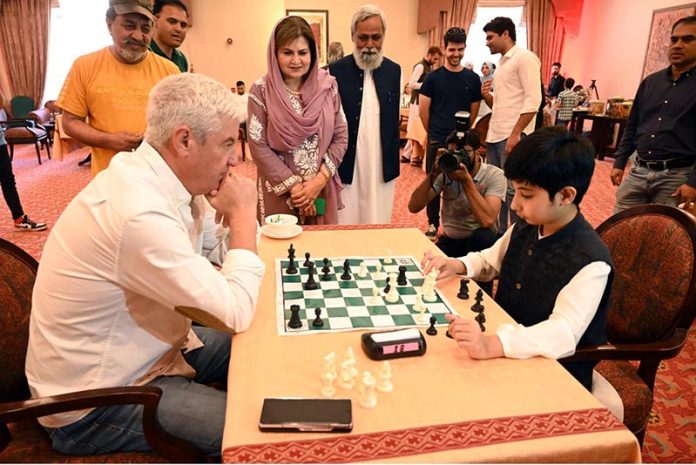 H.E. Frederico Silva, Ambassador of Portugal to Pakistan, takes part in the Portugal-Pakistan Chess Tournament, while Farah Naz Akbar, Parliamentary Secretary for the Ministry of Federal Education & Professional Training, observes the game. The tournament was held at a local hotel to mark 75 years of diplomatic relations between the two countries