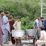 Volunteers serve Sabeel to the people attending the mourning procession of 10th Muharram ul Harram, to commemorate the death anniversary of Hazrat Imam Hussein, the grandson of prophet Muhammad (PBUH) and his companion, who were martyred in the battle of Karbala, Iraq