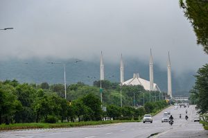 A captivating view of Faisal Masjid as dark monsoon clouds shroud the lush green Margalla Hills, adding to the scenic beauty of the Federal Capital.