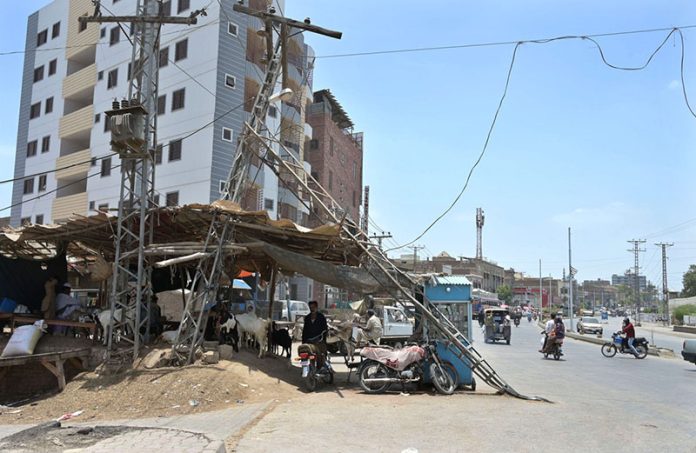 A damaged electric pole on Hala Naka Road, posing a safety risk and requiring urgent attention from the concerned authorities