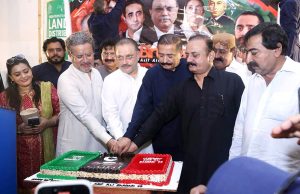 Sindh Senior Minister for Information Sharjeel Inam Memon cuts a cake to celebrate President Asif Ali Zardari's 70th birthday at Rawal House, Rahuki