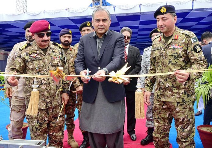 Federal Interior Minister Mohsin Naqvi Cutting Ribbon as Chief Guest on the Induction ceremony of the Pakistan Coast Guards (PCG) Rigid Hull Inflatable two new boats at Karachi Port