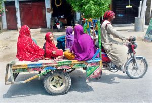 A Suzuki van loaded with bananas makes its way to the fruit market for delivery
