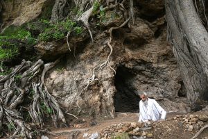 The Buddha Caves at Shah Allah Ditta are located in the heart of Margalla Hills on the natural route to the ancient city of Taxila. These caves are believed to be 2,400 years old. The Buddha caves are adjacent to a garden known as Sadhu ka Bagh. The village of Shah Allah Ditta is named on a dervish of Mughal era. The Buddha Caves consist of natural rock of Kanjur stone. The Kanjur stone used for the construction of Buddhist Stupa at Ban Faqiran, was also extracted from these rocks. These caves were first used by Buddhist monks for meditation. After the decline of Buddhism in Taxila, Hindu sadhus occupied these caves and painted some images of Hindu deities on the walls. There were many Hindu families living in Shah Allah Ditta Village before partition and the Caves were used by them for their daily worship. During the Mughal Period, Muslim ascetics took over the caves and built a square water tank on the water channel emerging from a natural water spring flowing since long. The water tank was constructed in lime stone laid in lime mortar. Mughal rulers and other emperors often passed through this region on their way to India from Afghanistan
