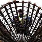 A worker busy welding as construction progresses on the Northern Bypass, connecting Warsak Road to Nasar Bagh Road.
