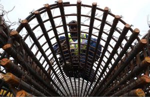 A worker busy welding as construction progresses on the Northern Bypass, connecting Warsak Road to Nasar Bagh Road.