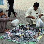 A vendor displaying toys to attract customers at the G-9 weekly bazaar in the Federal Capital