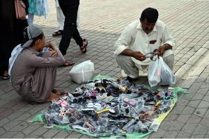 A vendor displaying toys to attract customers at the G-9 weekly bazaar in the Federal Capital