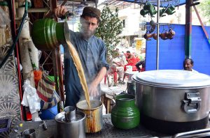- A worker busy preparing tea to attract customers at a local hotel.
