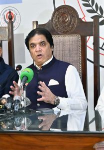 Federal Minister for Railways Hanif Abbasi is talking to the guest of honor at the Press Club