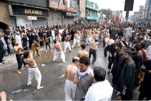 Volunteers serving drinks (Sabeel) to the mourners during procession at Sadar Road on 9th of the Holy Month of Muharram Ul Haram. Muharram Ul Haram is known as the first month of the Islamic calendar and the mourning month in remembrance of the martyrdom (Shahadat) of Hazrat Imam Hussain (AS) the grandson of the Holy Prophet Mohammad (SAWW)