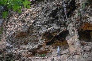 The Buddha Caves at Shah Allah Ditta are located in the heart of Margalla Hills on the natural route to the ancient city of Taxila. These caves are believed to be 2,400 years old. The Buddha caves are adjacent to a garden known as Sadhu ka Bagh. The village of Shah Allah Ditta is named on a dervish of Mughal era. The Buddha Caves consist of natural rock of Kanjur stone. The Kanjur stone used for the construction of Buddhist Stupa at Ban Faqiran, was also extracted from these rocks. These caves were first used by Buddhist monks for meditation. After the decline of Buddhism in Taxila, Hindu sadhus occupied these caves and painted some images of Hindu deities on the walls. There were many Hindu families living in Shah Allah Ditta Village before partition and the Caves were used by them for their daily worship. During the Mughal Period, Muslim ascetics took over the caves and built a square water tank on the water channel emerging from a natural water spring flowing since long. The water tank was constructed in lime stone laid in lime mortar. Mughal rulers and other emperors often passed through this region on their way to India from Afghanistan