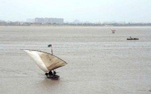 Fishermen catching the fish on their boat at Indus river