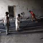 Labourers busy in bending and arranging iron rods at a steel workshop near I-9 area in the Federal Capital