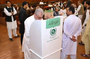 A member of KP Assembly casting his vote for a woman seat vacant after resignation of Senator Sania Nishtar at KP Assembly.