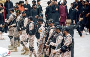 Security personnel high alert to protect the people attending the mourning procession of Ashura on 10th Muharram-ul-Haram at Empress Market. Shia Muslims commemorate the death anniversary of Hazrat Imam Hussein (AS), the grandson of prophet Muhammad (PBUH) and his companion, who were martyred in the battle of Karbala, Iraq