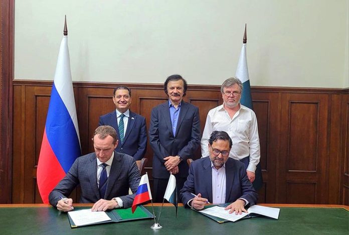 Mr. Saif Anjum, Secretary of Industries and Production, and Mr. Vadim Velichko, General Director of Industrial Engineering LLC, signing Protocol to restore and modernize Pakistan Steel Mills (PSM)