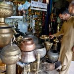 A vendor display antique items to attract customers at Saidpur Village, reflecting its rich cultural heritage in the heart of the Federal Capital