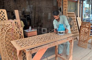 Labourers busy in bending and arranging iron rods at a steel workshop near I-9 area in the Federal Capital