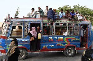 Women hanging on the gate and other passengers sitting on the rooftop of a moving bus pose serious safety risks, a situation that requires urgent attention from the concerned authorities in the Provincial Capital.