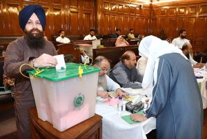 A member of KP Assembly casting his vote for a woman seat vacant after resignation of Senator Sania Nishtar at KP Assembly.