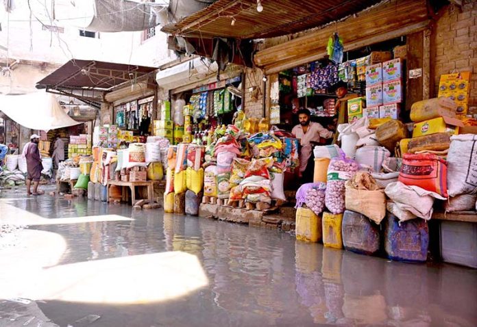 A view of stagnant sewerage water accumulated in front of Shahi Bazar shops needs the attention of the concerned authorities