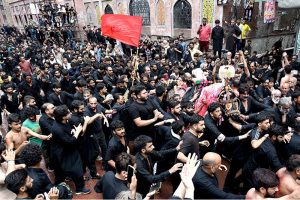 A large number of mourners attending the procession of Aashura on 10th Muharram-ul-Haram. Shia Muslims commemorate the death anniversary of Hazrat Imam Hussein (AS), the grandson of prophet Muhammad (PBUH) and his companion, who were martyred in the battle of Karbala, Iraq