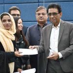 Federal Minister for Education and Professional Training, Dr. Khalid Maqbool Siddiqui, distributes prizes among position holders during the launching ceremony of the Annual Pakistan Non-Formal Education Statistical Report 2023-24 at the Auditorium of Allama Iqbal Open University (AIOU)