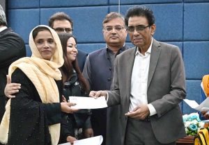 Federal Minister for Education and Professional Training, Dr. Khalid Maqbool Siddiqui, distributes prizes among position holders during the launching ceremony of the Annual Pakistan Non-Formal Education Statistical Report 2023-24 at the Auditorium of Allama Iqbal Open University (AIOU)