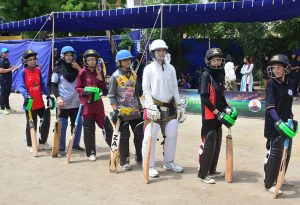 Female cricket players wait to give their trials during the two-day Prime Minister Youth Program organized by Lahore Qalandars at the Police Headquarters Ground.