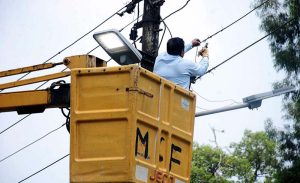 A TMA worker repairs a streetlight on Jail Road as part of routine maintenance.