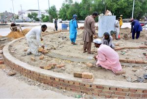 Labourers busy in construction work of new Auto Bahn Road during development work in the city