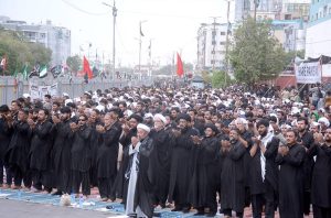 Mourners passing through M.A. Jinnah Road during the 9th Muharram-ul-Haram procession. Muharram ul Harram is the mourning month in remembrance of the martyrdom (Shahadat) of Hazrat Imam Hussain (AS), the grandson of the Holy Prophet Mohammad (SAWW) at the battle of Karbala