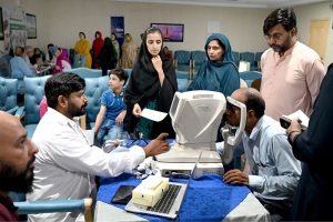 Doctors examine patients’ eyes during a free surgical eye camp organized by Al-Shifa Trust Eye Hospital at the National Press Club