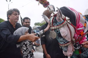Mourners passing through M.A. Jinnah Road during the 9th Muharram-ul-Haram procession. Muharram ul Harram is the mourning month in remembrance of the martyrdom (Shahadat) of Hazrat Imam Hussain (AS), the grandson of the Holy Prophet Mohammad (SAWW) at the battle of Karbala
