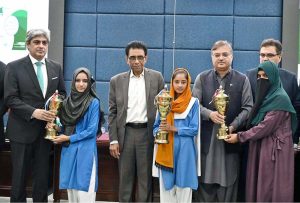 Federal Minister for Education and Professional Training, Dr. Khalid Maqbool Siddiqui, distributes prizes among position holders during the launching ceremony of the Annual Pakistan Non-Formal Education Statistical Report 2023-24 at the Auditorium of Allama Iqbal Open University (AIOU)