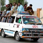 Passengers traveling on the rooftop of a van at Naudero-Ratodero Road may cause any mishap and needs the attention of concerned authorities