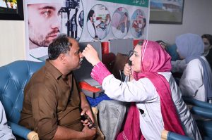 Doctors examine patients’ eyes during a free surgical eye camp organized by Al-Shifa Trust Eye Hospital at the National Press Club