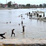 Youngsters cool off in Rice Canal to beat the scorching heat as temperatures continue to rise in the city