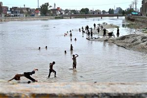 Youngsters cool off in Rice Canal to beat the scorching heat as temperatures continue to rise in the city