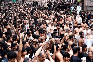 A large number of mourners attending the procession of Aashura on 10th Muharram-ul-Haram. Shia Muslims commemorate the death anniversary of Hazrat Imam Hussein (AS), the grandson of prophet Muhammad (PBUH) and his companion, who were martyred in the battle of Karbala, Iraq